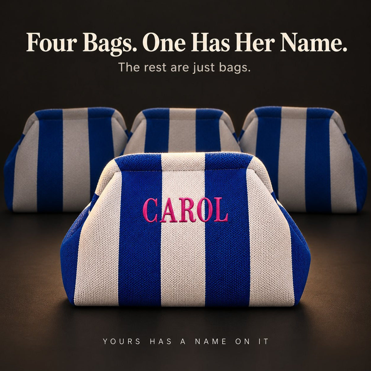 Four cobalt and white mahjong tile bags; only the front one is embroidered "Carol" in hot pink