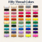 Fifty embroidery thread spools for the mahjong tile bag, labeled T1 to T50 in a rainbow of colors