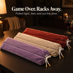 Lavender, cream and brick red velvet mahjong rack bags tied with white bows beside wine glasses