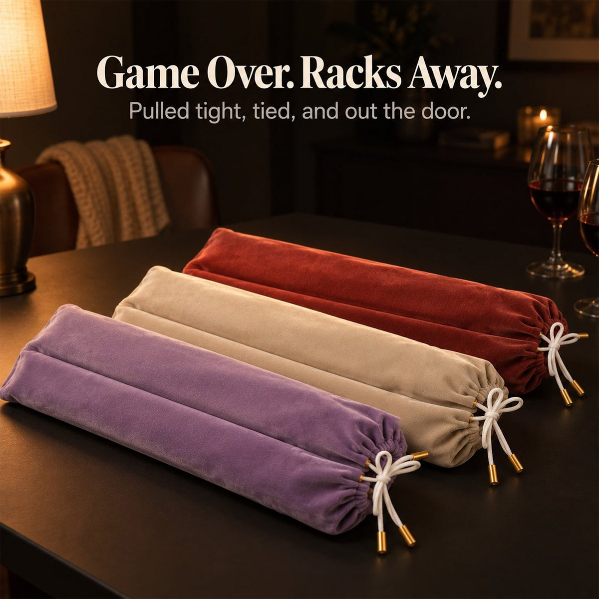 Lavender, cream and brick red velvet mahjong rack bags tied with white bows beside wine glasses