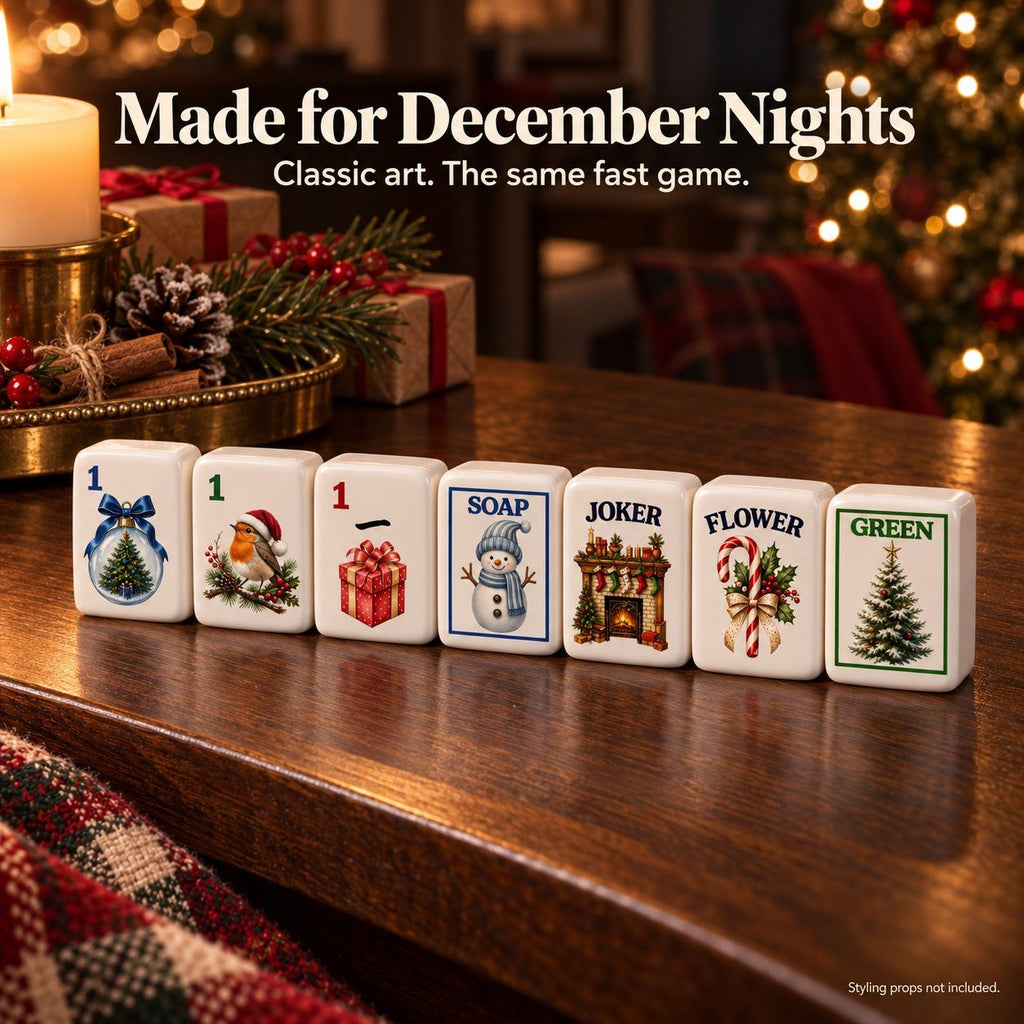 Christmas mahjong tiles on a wooden table: 1 Dot, 1 Bam, 1 Crak, Soap, fireplace Joker, Flower and Green