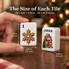 Hand holding a gingerbread 1 Dot tile beside a cottage Joker, sized 1.18 x 0.87 x 0.55 in (30 x 22 x 14 mm)