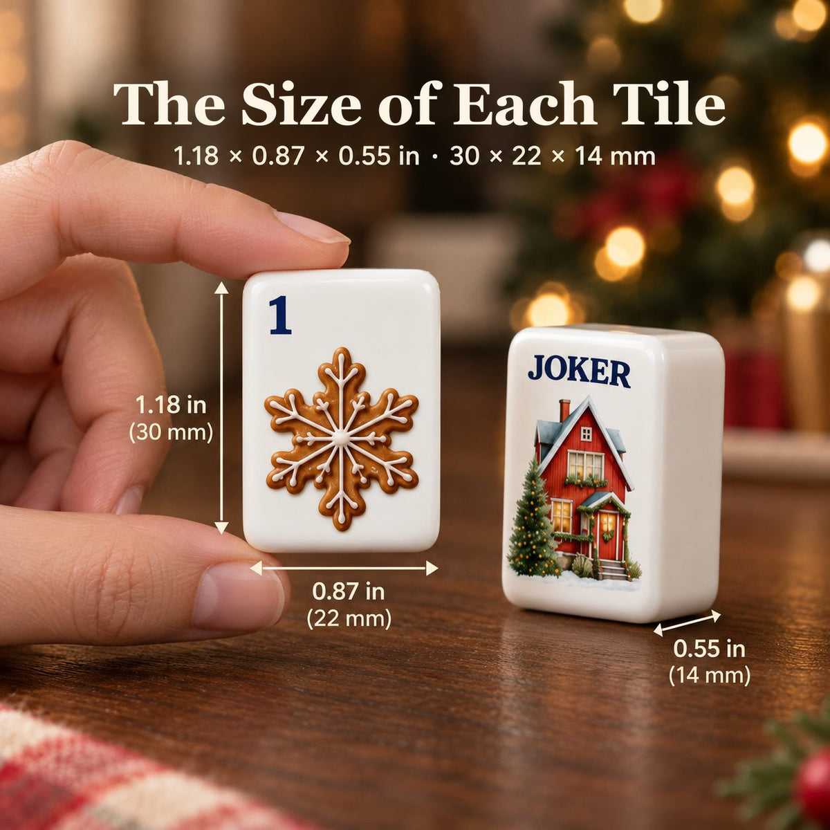 Hand holding a gingerbread 1 Dot tile beside a cottage Joker, sized 1.18 x 0.87 x 0.55 in (30 x 22 x 14 mm)
