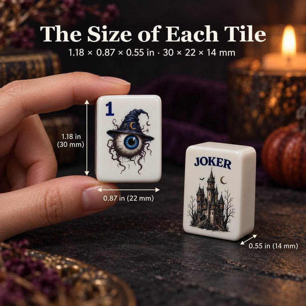 Hand holding a 1 Dot eyeball tile next to a castle Joker tile, sized 1.18 x 0.87 x 0.55 in (30 x 22 x 14 mm)