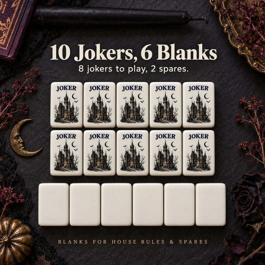 Ten haunted castle Joker tiles above six blank tiles on dark slate with gothic props