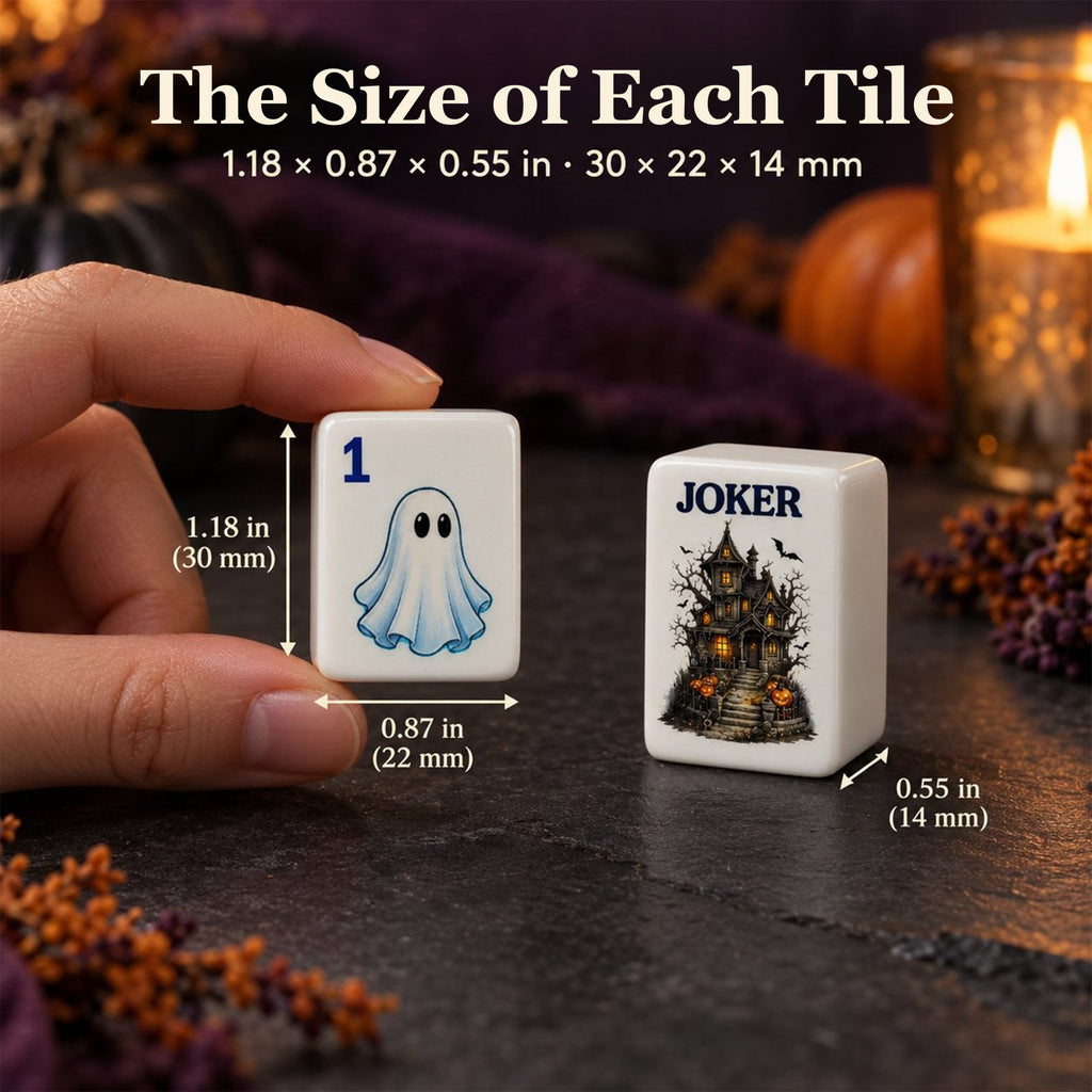 Hand holding a ghost 1 Dot tile next to a haunted-house joker, sized 1.18 x 0.87 x 0.55 in (30 x 22 x 14 mm)