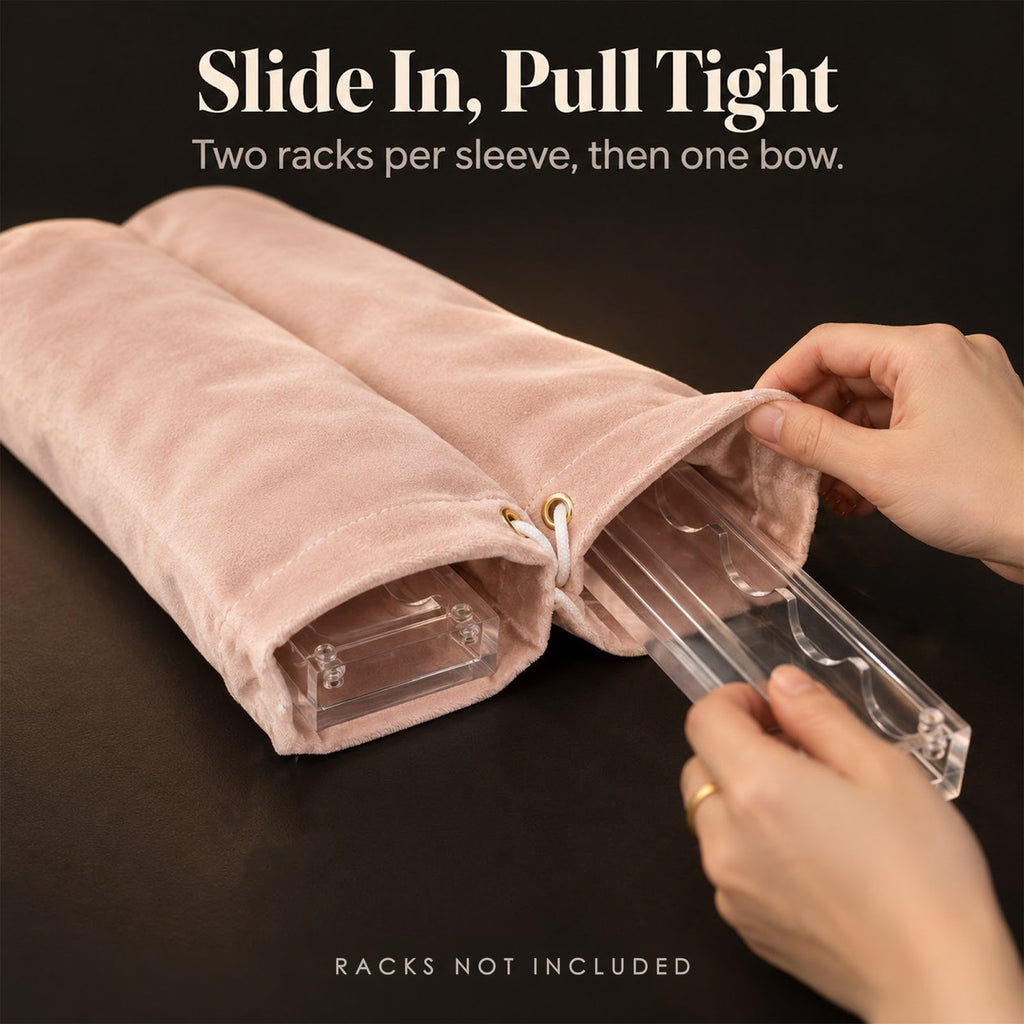 Hands sliding a clear rack into a blush pink velvet mahjong rack bag, captioned "Racks not included"