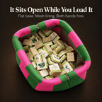 Open green and hot pink mahjong tile bag seen from above, filled with tiles and lined with mesh